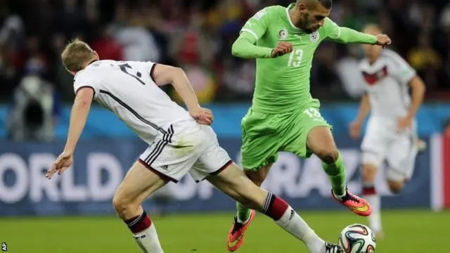 Algeria player takes on German