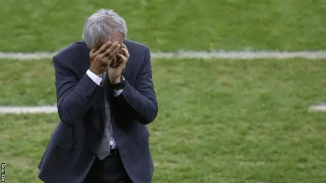 Algeria manager with head in hands