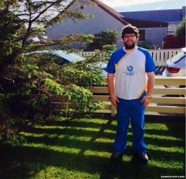 Martin Summers poses in baton relay uniform