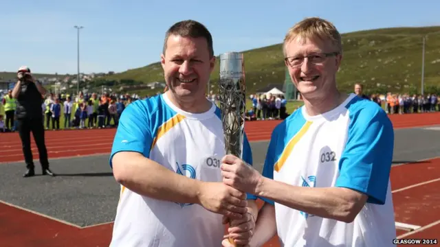 Mark Wylie and Martin Leyland hold the baton