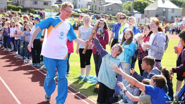 Martin Leyland with the baton at Clickimin Athletics Track