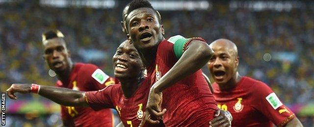 Asamoah Gyan celebrates scoring against Germany