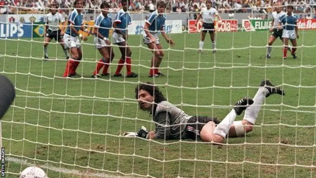 West German defender Andreas Brehme (2nd right) scores on a free kick against France at 1986 World Cup