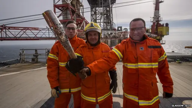 Oil rig workers with the Glasgow 2014 Queen's Baton on Clair Oil Platform.