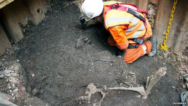 A Crossrail worker excavates a skeleton