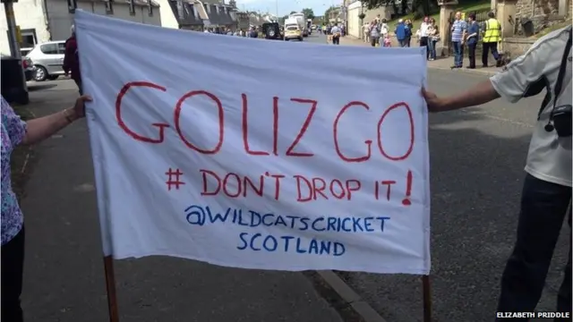 Home made banner saying "Go Liz go. # Don't drop it! @ Wildcats Cricket Scotland"