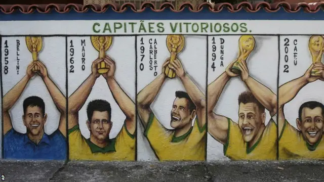 Brazil's World Cup winning captains are sprayed onto a wall