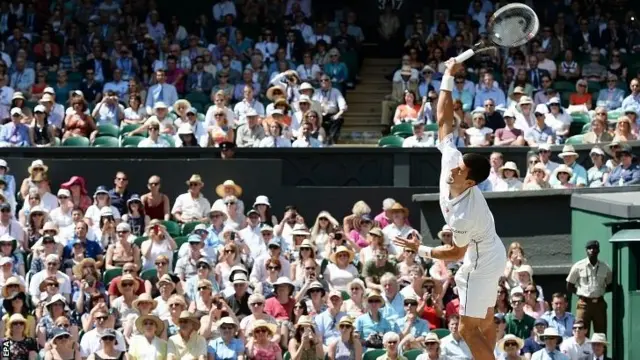 Novak Djokovic serves