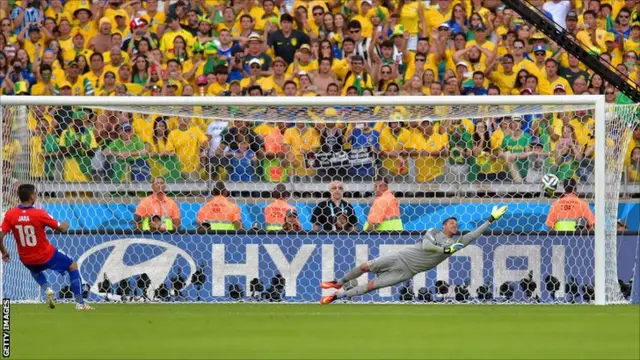 Gonzalo Jara of Chile shoots and hits the post to miss the decisive penalty