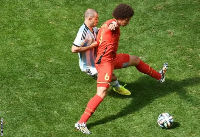 Javier Mascherano hustles Axel Witsel