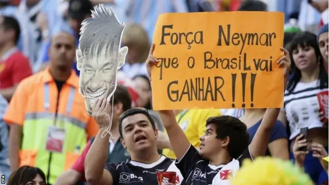 Fans with Neymar mask/banner