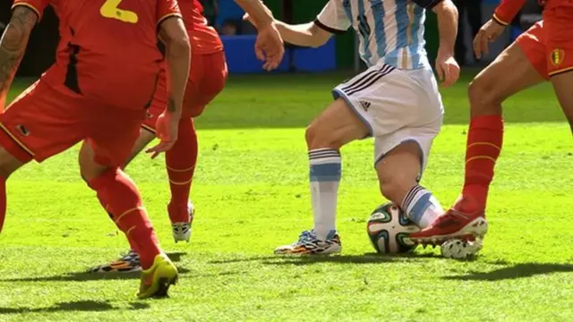 Lionel Messi is tackled