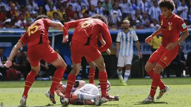 Belgium players foul Lionel Messi