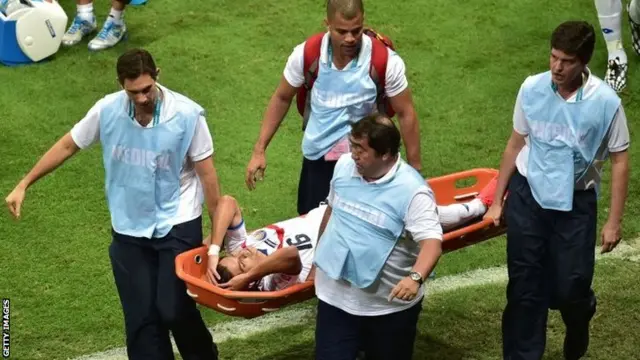 Cristian Gamboa on a stretcher