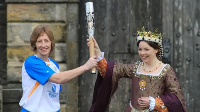 Katriona Bush and Mary of Guise with the baton