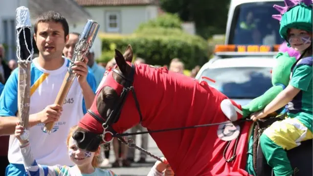 Youngsters, horse and baton bearer Adam Brown in Kippen