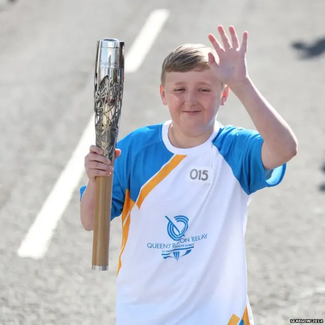 Aaron McNally carries Queen's baton