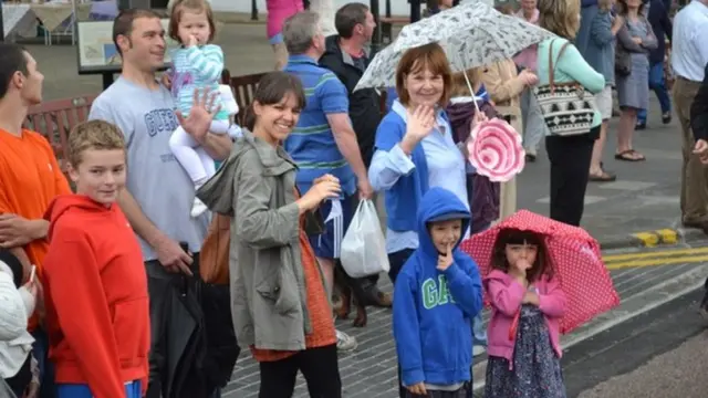 Spectators watch the Queen's Baton relay in Callander