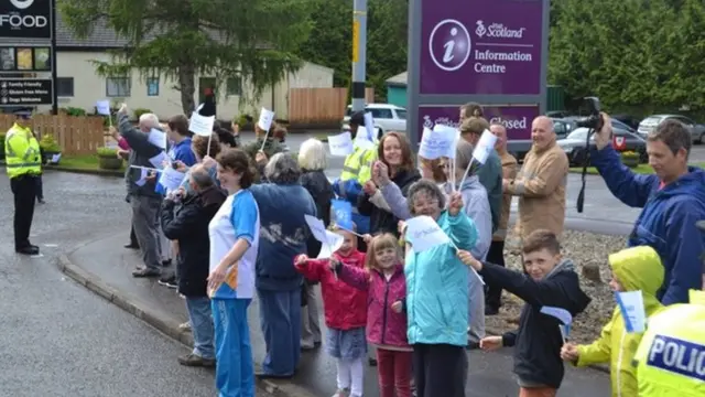 Crowd waving flags in Tyndrum