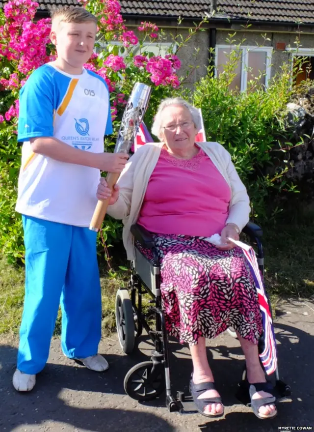 Marion Black poses with baton bearer Aaron McNally