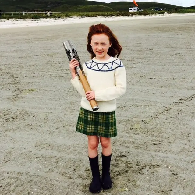 Katie Morag, played by Cherry Campbell, holds baton on Barra beach