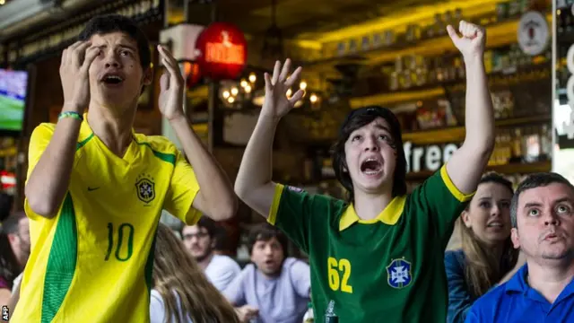 Brazil fans watch on television