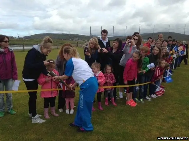 Kids at Daliburgh get a look at the Queen's Baton