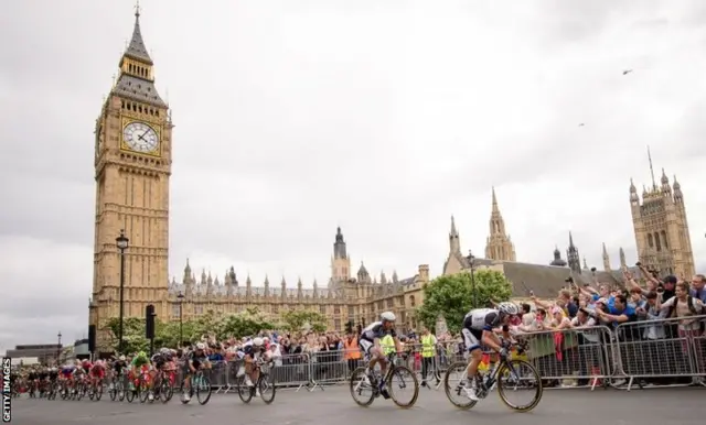 Riders pass The Houses of Parliament in stage three