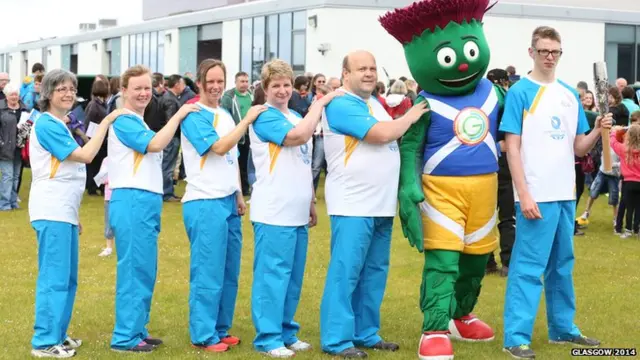 Left to right, Susannah Dawson, Marion Lindsay Steele, Christine Lindsay MacQuarrie, Jane MacIntyre, Ronald MacPhee, Clyde, the Glasgow 2014 mascot, and Joseph MacInnes