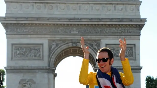 ritish cyclist Bradley Wiggins, celebrates during his parade in front of the Arc de Triomphe at the end of the last stage of the 2012 Tour de France