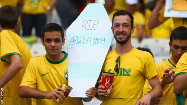 Brazil fans enjoy the atmosphere prior to the 2014 FIFA World Cup Brazil Semi Final match