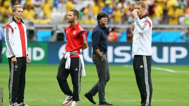 Head coach Joachim Loew of Germany walks on the pitch with his players