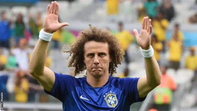 Brazil"s defender David Luiz applauds supporters