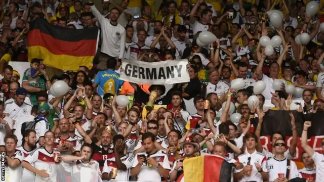 Fans of Germany cheer before the semi-final football match between Brazil and Germany