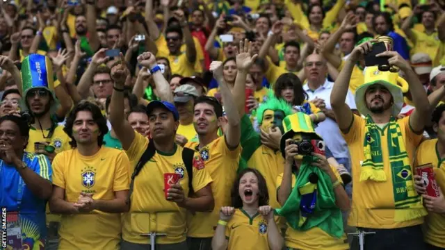 Brazilian fans cheers before the semi-final football match between Brazil and Germany