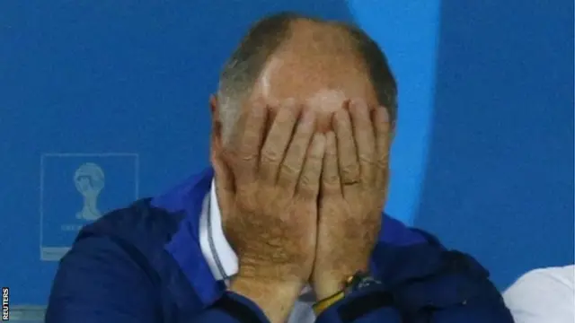 Brazil's coach Luiz Felipe Scolari reacts with his head in his hands