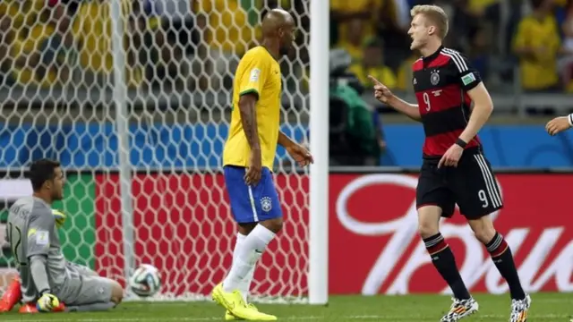 Andre Schurrle celebrates after scoring