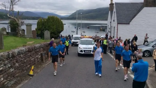 Iain McCall carries the baton