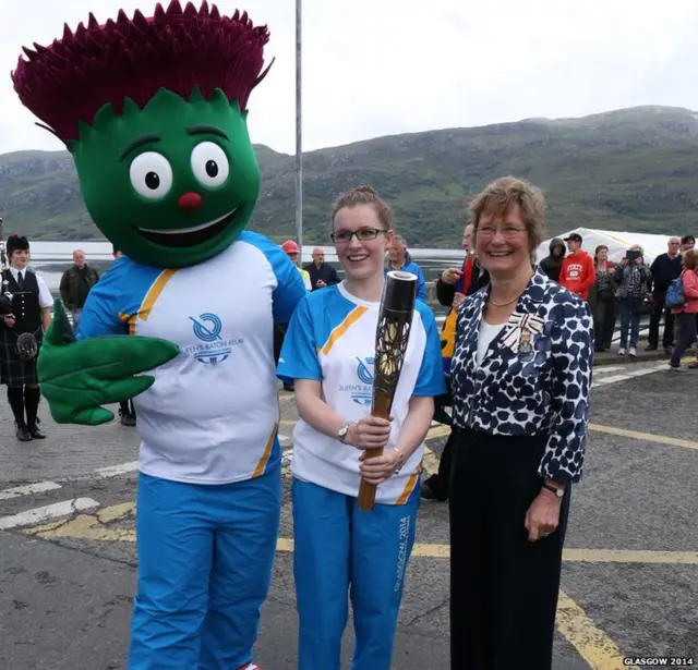 Clyde the the Glasgow 2014 Commonwealth Games mascot and baton bearer Jessica Ryan