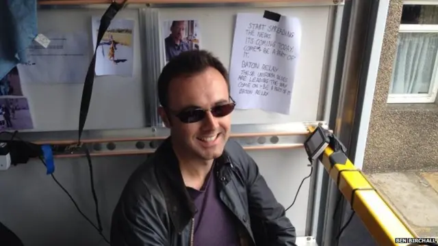 BBC Producer Simon Dedman sits in the back of the media vehicle