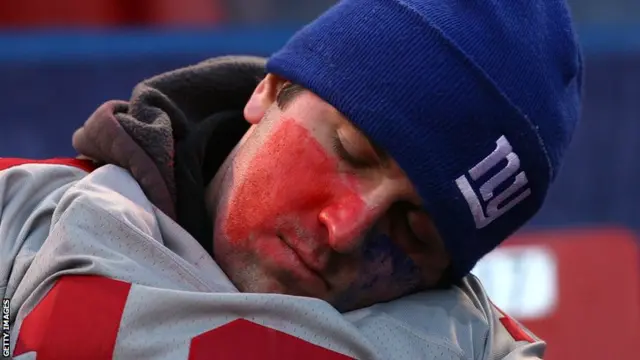 New York Giants fan has a snooze