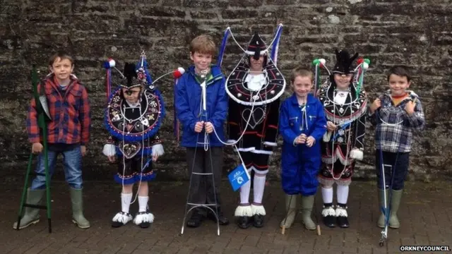 Children dressed as ploughmen and horses