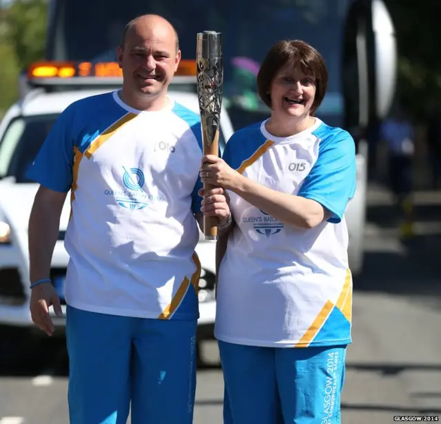 Alison Henderson hands the baton to Alan Johnston