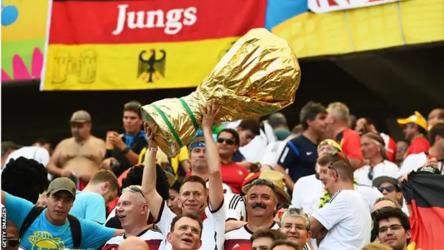 Germany fans with World Cup trophy