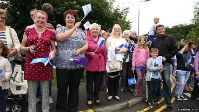 Members of the public welcome the Glasgow 2014 Queen's Baton through Oban in Argyll & Bute