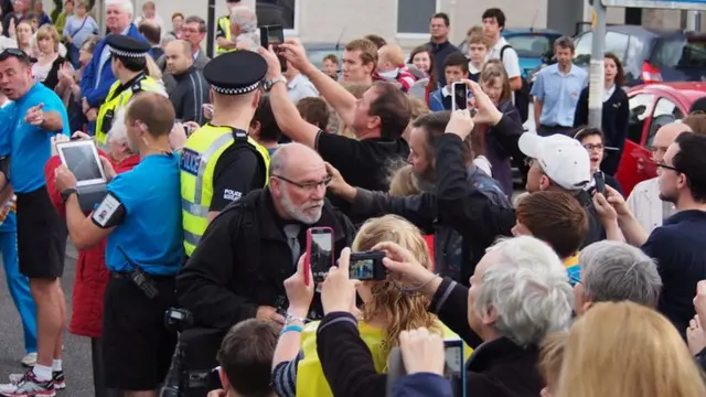 Crowds support the baton bearers in Greenock