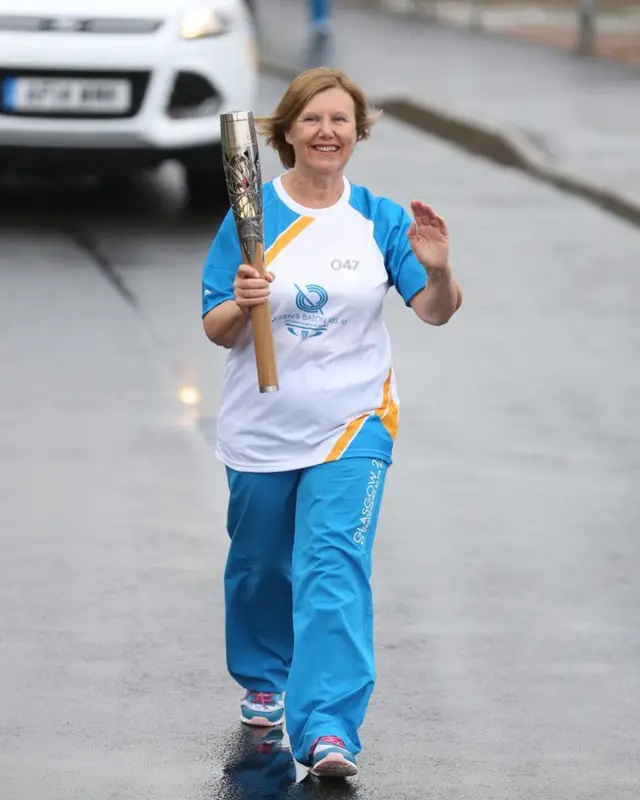 Anne O'Neill waves to the Port Glasgow crowds