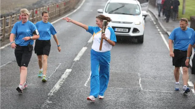 Mary Jane Rodger runs with the baton