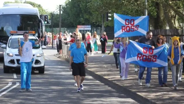 Ross Carswell with the baton