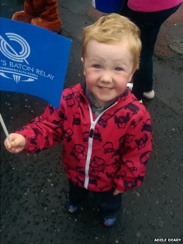 Oliver Deary cheers on the Queen's Baton Relay